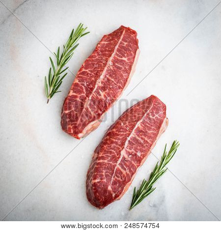 Raw Fresh Meat Top Blade Steaks On Light Background. Top View.