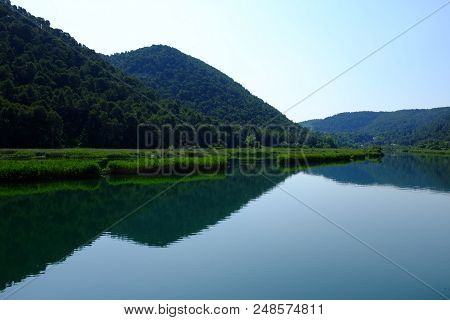 Beautiful Reflection On Krka River Water At Skradin, Croatia