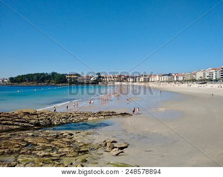 People Enjoying Summer In The Urban Beach Of Silgar In Sanxenxo Galicia Spain.