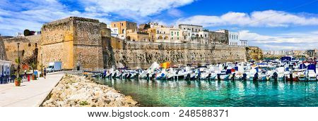 Beautiful Otranto town- view of old part with medieval Aragonese castle and marina. Puglia, Italy