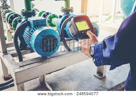 Technician Thermography Servicing An Water Motor Cooling Tower In Factory