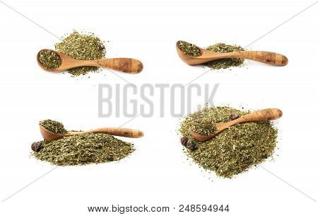 Pile Of Mate Tea Leaves With The Wooden Serving Spoon Over It, Composition Isolated Over The White B