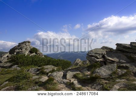 Photo Of Mountain Landscape In The Summer Under Beautiful Cloudy Sky. Ukraine, Carpathians, Dzembron