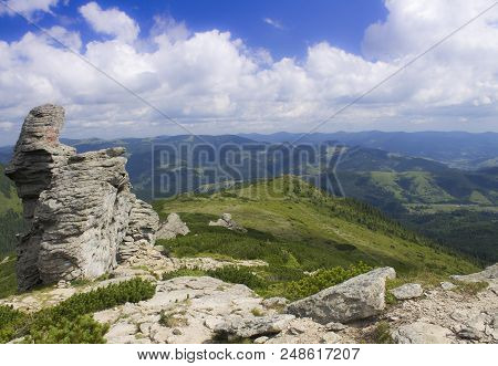 Photo Of Mountain Landscape In The Summer Under Beautiful Cloudy Sky. Ukraine, Carpathians, Dzembron