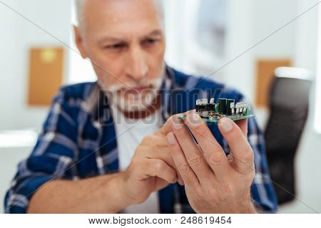 Sophisticated Technology. Selective Focus Of A Microscheme Being In Hands Of A Smart Positive Engine