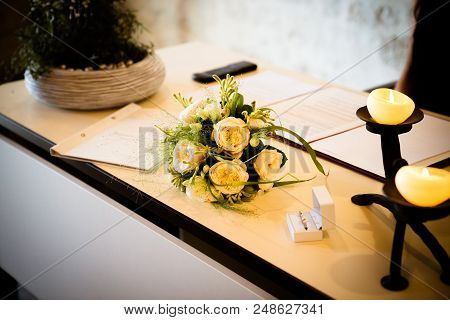 In The Registry Office, The Bridal Bouquet Is On The Table And The Celebration Begins