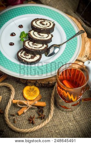Chocolate Roll With Coconut Filling And Chocolate Sauce