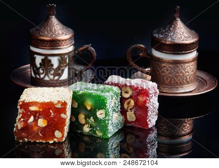 Multicolored Rahat Lukum On The Table, Followed By Cups With Fragrant Turkish Coffee.