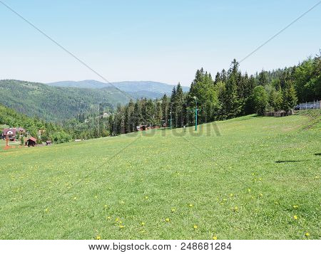 Fantastic Landscapes Of Grassy Field And Forest At Beskid Mountains Range In European Salmopol Pass 