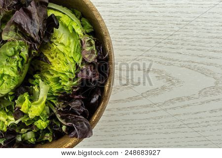 Fresh Green Lettuce Red Little Gem Variety Chopped In A Wooden Bowl Flatlay On Grey Wood