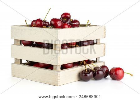 Sweet Bright Red Cherry In A Wooden Box Isolated On White