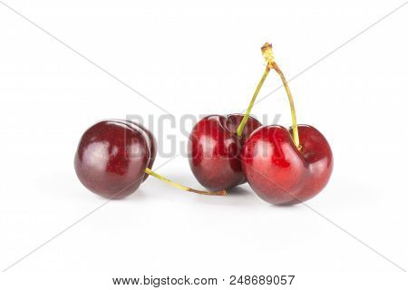 Group Of Three Whole Sweet Bright Red Cherry Set Isolated On White