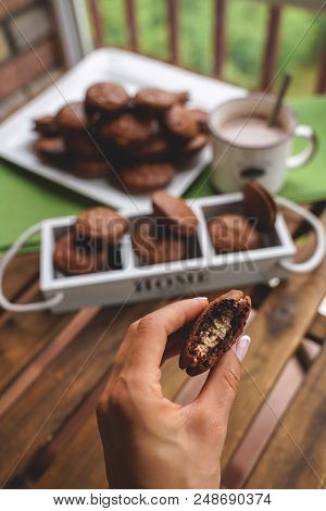 Fudge Brownie Cookies With Penut And Cheese Filling On White Plate On Wooden Background With Cacao O