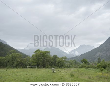 Foorball Field With Goals In Valley Between Mountains Of French Haute Provence
