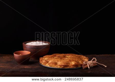 On A Dark Wooden Table American Apricot Pie, Ingredients And Tools