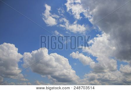 Blue sky and white clouds. Summer sky. Sky background. Sky and clouds. Skyground. Horizon. Azure. Nature background. White clouds.