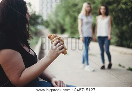 Excessive Weight, Overeating, Obesity, Bad Habits And Lifestyle. Overweight Woman Sit In The Street 