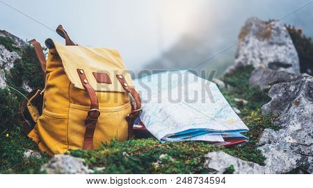 Hipster Hiker Tourist Yellow Backpack And Map Europe On Background Green Grass Nature In Mountain, B
