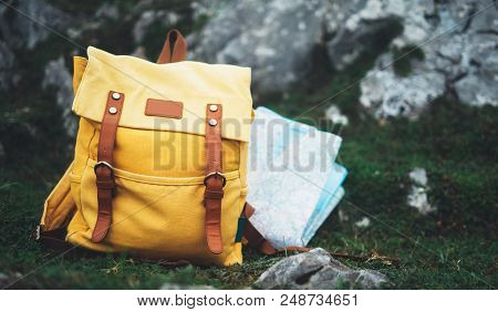 Hipster Hiker Tourist Yellow Backpack And Map Europe On Background Green Grass Nature In Mountain, B
