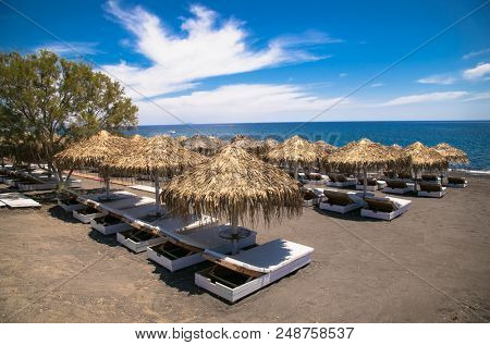 Permissa black sand beach in Santorini. Greece. 