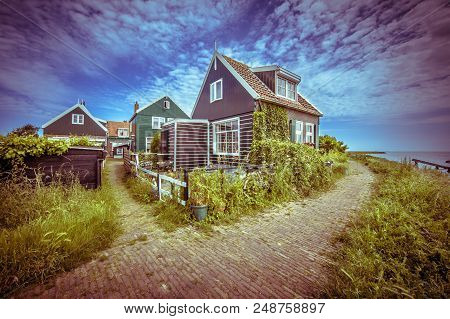 Beatiful Street In Typical Fishing Village Of Rozewerf Scene On Marken Island Waterland, With Icebre