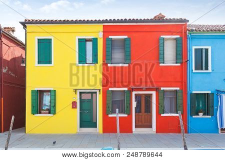 Rectilinear View Of The Colored Facades Of Buildings On The Island Of Burano, Near Venice, Italy