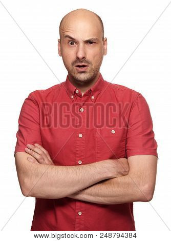 Grumpy Bald Man Looking At Camera