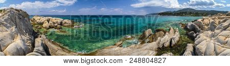 Beautiful Panorama With The Mediterranean Sea In Greece. Crystal And Colorful Water, Rocks, Vegetati