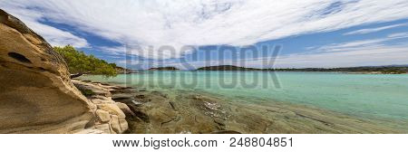 Beautiful Panorama With The Mediterranean Sea In Greece. Crystal And Colorful Water, Rocks, Vegetati