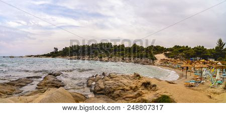 Beautiful Panorama With The Mediterranean Sea In Greece. Crystal And Colorful Water, Rocks, Vegetati