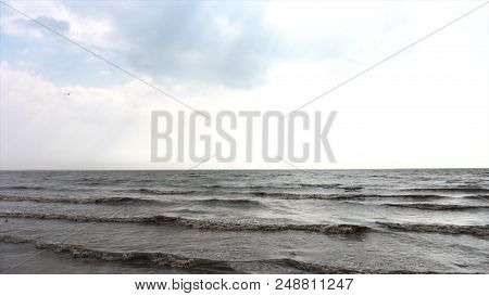 Sea Waves With Sun And Blue Sky. Azure Calm Sea With Orange Beach And Cloudy Blue Sky. Low Angle, Wi