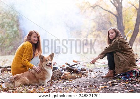 Happy Family - Smiling Mom, Daughter And Dog On Picnic In The Autumn Forest