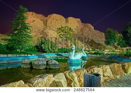 The Small Pond With Swan Sculptures In Front Of Ancient Adobe Dokhtar Castle (anahita Or Nahid Fire 