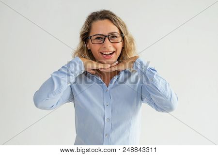 Happy Excited Lady Leaning Head On Hands And Looking At Camera. Cheerful Optimistic Businesswoman In