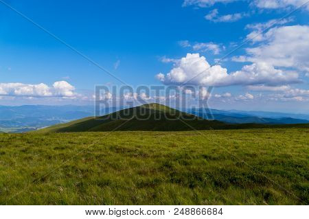 Trampled Path Through The Top Of The Mountain Against The Background Of Sky Blue In The Carpathians