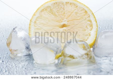 Lemon Ring With Ice On A Silvery Background Closeup