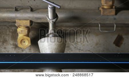 Pipes Manufacturing Production Line. Manufacture Of Plastic Water Pipes Of The Factory. Process Of M