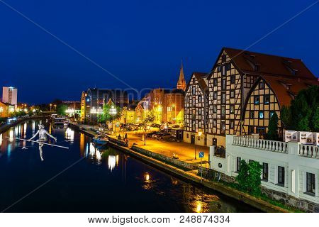 Bydgoszcz, Poland, May 31, 2018: The Waterfront On The River Brda With Famous Granaries At Night In 