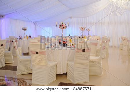 The Banquet Hall With Round Tables