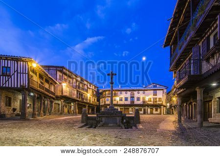 La Alberca, Salamanca, Spain, February 2016: Main Square With A Commemorative Cross At Sunrise  At S