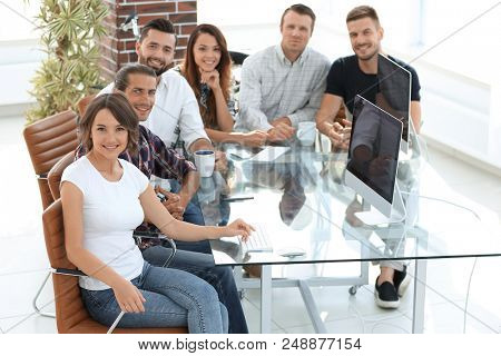 group of young employees discussing ideas