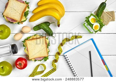 Top View Planning Notebook With Copy Space And Healthy Breakfast. Sandwich With Ham And Cheese, Eggs
