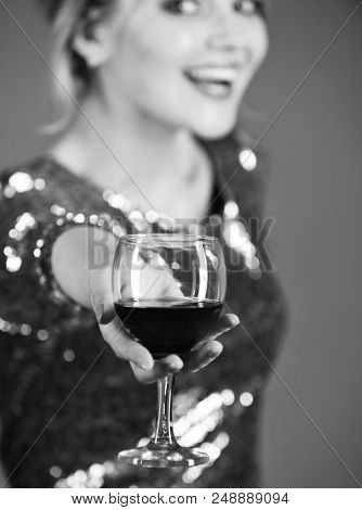 Lady Holding Cabernet Or Merlot With Smiling Face. Glass Of Red Wine In Selective Focus. Winetasting