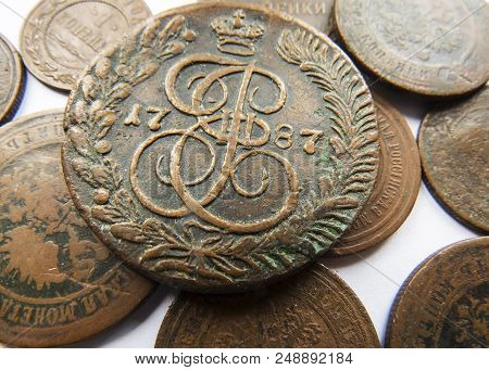 Pile Of Vintage Metall (copper) Coins.coins Of The Russian Empire In The Background Kopyur.antikvari