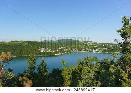 Top View Of The Picturesque Lake Abrau Against The Slopes Of The Caucasus Mountains. Peace And Quiet