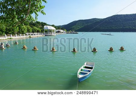 Mountain Lake Abrau And Feeders For Wild Waterfowl On The Water. Peace And Quiet In The Resort Villa