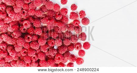 Dripping Raspberry On White Background. Close-up Photo.