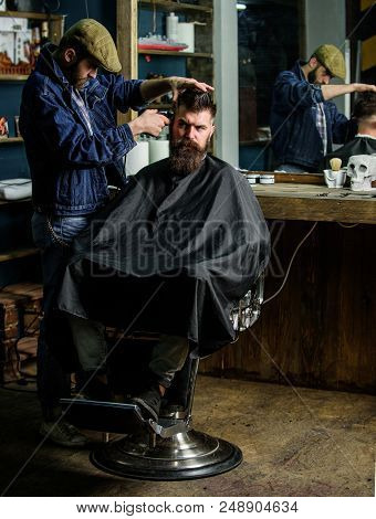 Hipster Client Getting Haircut. Barber With Clipper Trimming Hair On Temple Of Client. Hipster Lifes