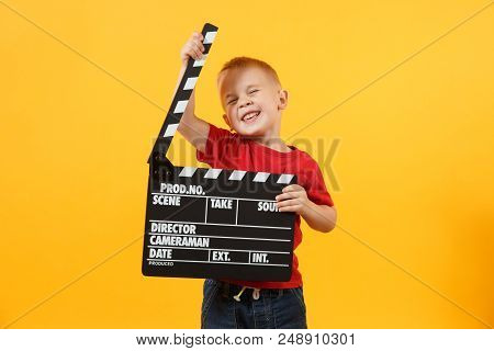 Little Cute Kid Baby Boy 3-4 Years Old In Red T-shirt Holding In Hand Classik Black Film Making Clap
