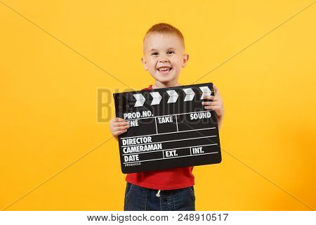 Little Cute Kid Baby Boy 3-4 Years Old In Red T-shirt Holding In Hand Classik Black Film Making Clap